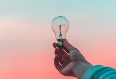 person holding light bulb