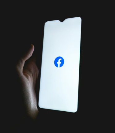 white apple device with blue logo